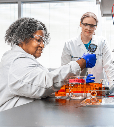 Two female laboratory professionals collaborating within a state-of-the-art laboratory environment