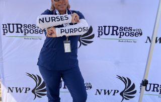 Cleveland Clinic nurse LaTasha Moore wearing scrubs at a Nurses With Purpose medical mission event