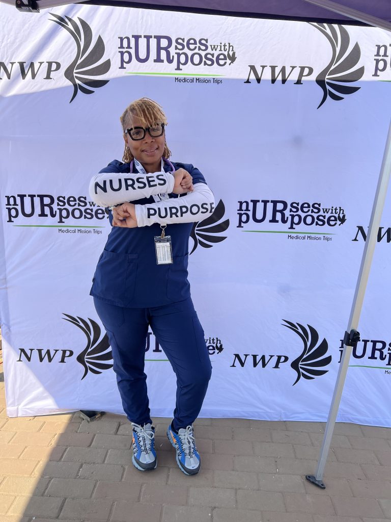 Cleveland Clinic nurse LaTasha Moore wearing scrubs at a Nurses With Purpose medical mission event